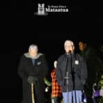 Two elderly men give karakia at dawn