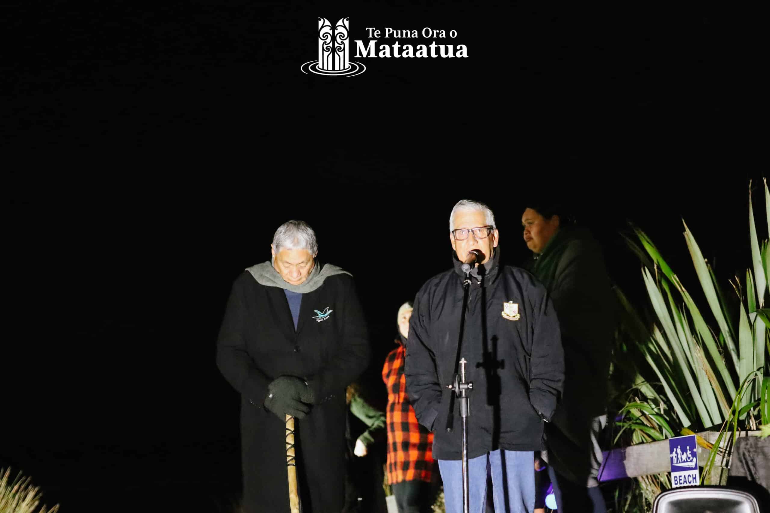 Two elderly men give karakia at dawn